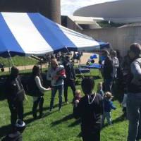 GVSU volleyball alumni, friends, and family outside at a tailgate